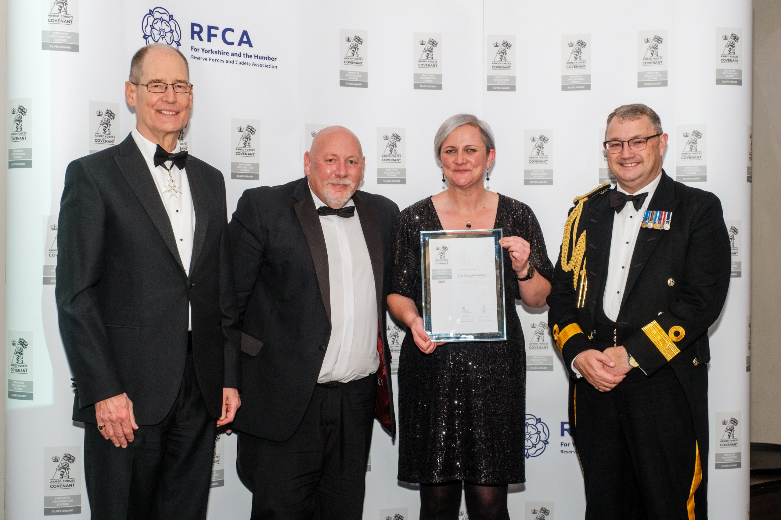 HM Lord-Lieutenant of West Yorkshire Ed Anderson with award winners from Fuel Storage Solutions Jonny Morris and Karen Gorman with Commodore Phil Waterhouse
