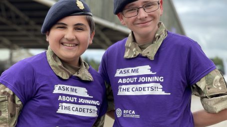 Two cadets smiling in front of a barn at the Great Yorkshire Show