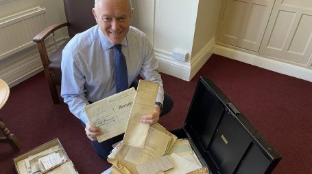 Man holds old documents