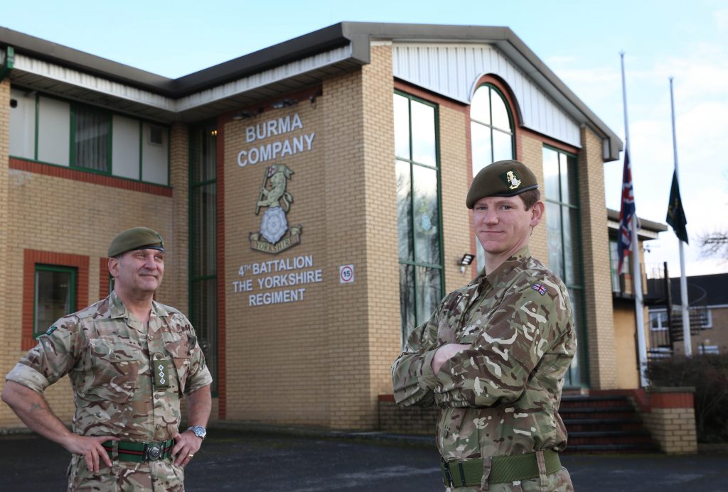 Reserve Ryan Shippey outside Burma Company's headquarters in Barnsley with a senior officer looking on.
