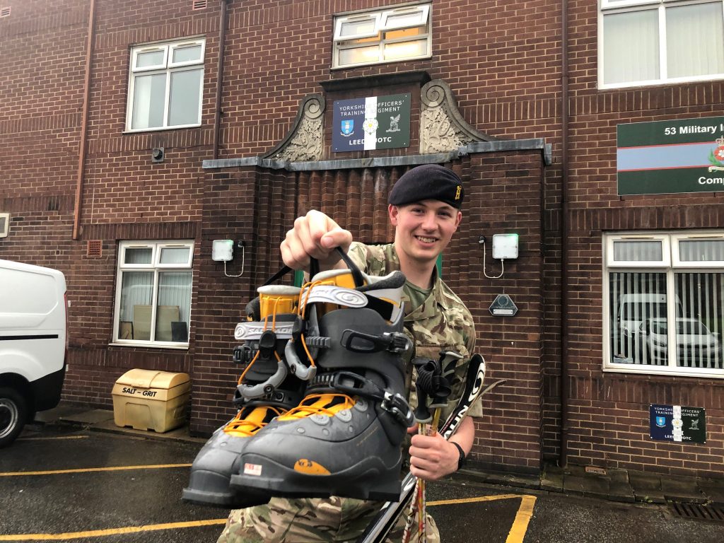 Officer cadet holding skis