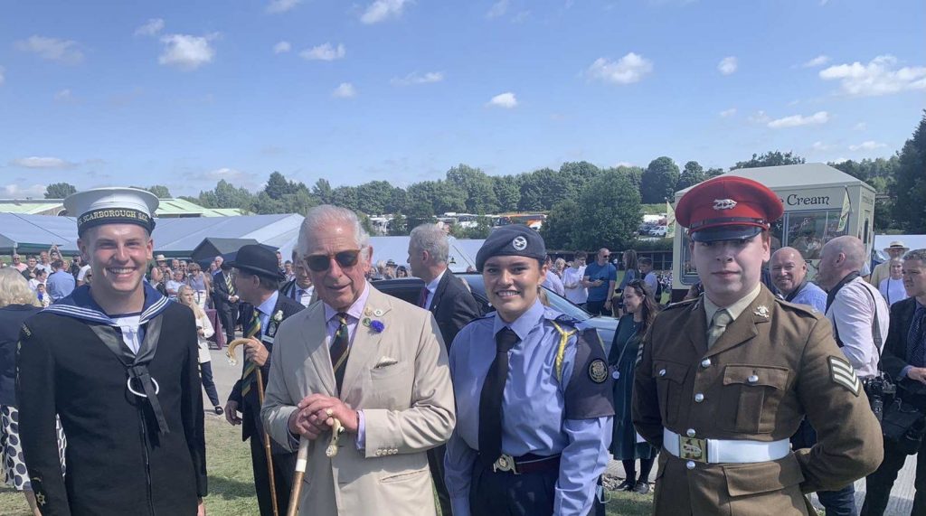 Three cadets from each of the services accompanying, the then, Prince Charles at the Great Yorkshire Show in 2021 