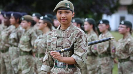 Female cadet with pace stick