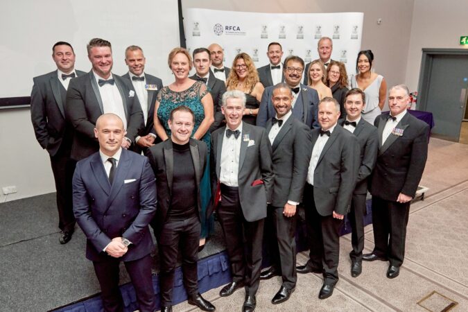 A group of people in black tie