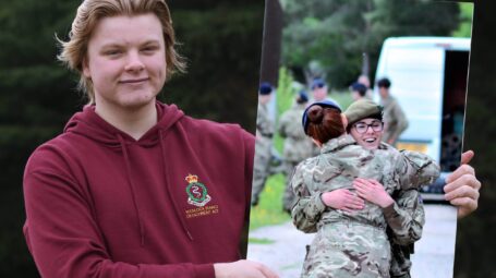 Picture of a male cadet holding a photo board of his winning RFCA cadet photography competition photo