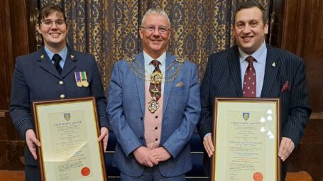 Air cadet volunteer, Danielle cooper, Lord mayor, Kalvin Neal, army cadet volunteer, Fred Owen, standing in a line holding their certificates