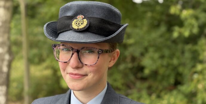 Samantha Lowes dresses in Air Cadet uniform smiles in front of greenery