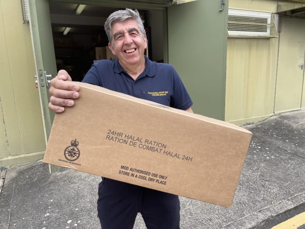 Man holds big box outside storage locker