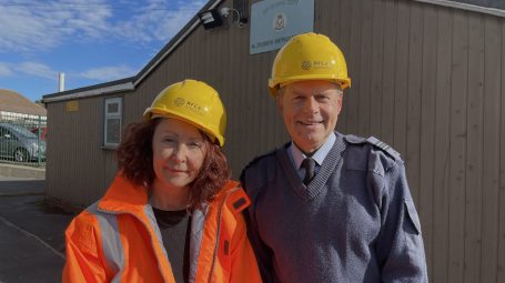 Woman and man in hard hats - man is wearing a Air Cadet uniform