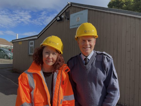 Woman and man in hard hats - man is wearing a Air Cadet uniform