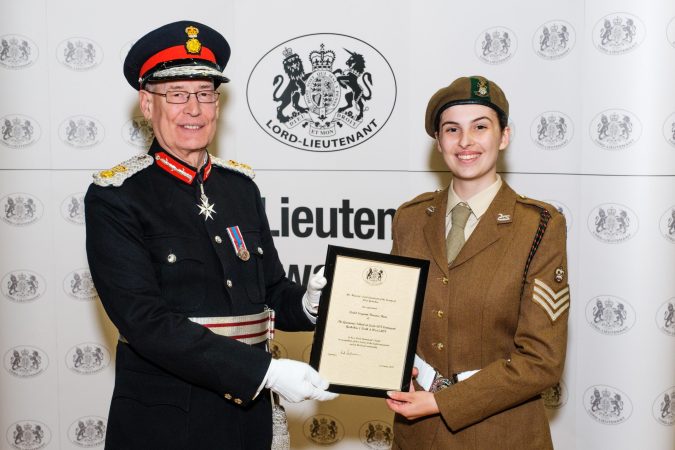 Female army cadet with Lord Lieutenant holding certificate