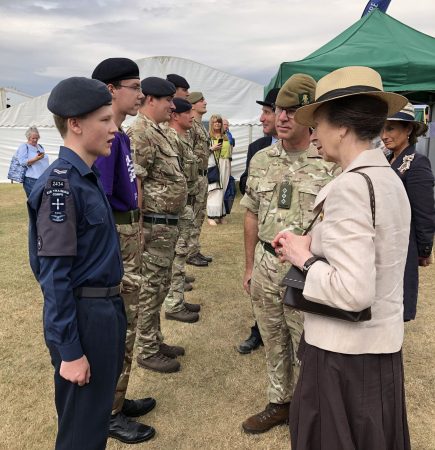 individuals standing in a line greeting HRH Princess Anne