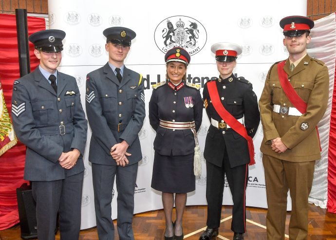 Group photo of four cadets in uniform and the Lord-Lieutenant