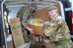Reservists Conrad Chamberlain and Dave Midgley unload supplies