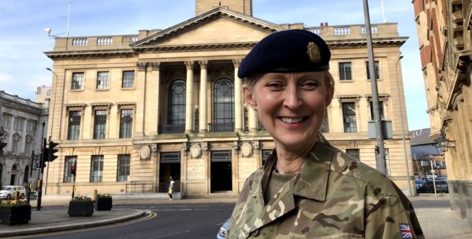 Female in front of Hull Civic Hall in army dress