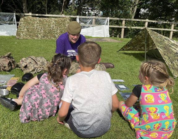 small children chat to a cadet force adult volunteer at great yorkshire show