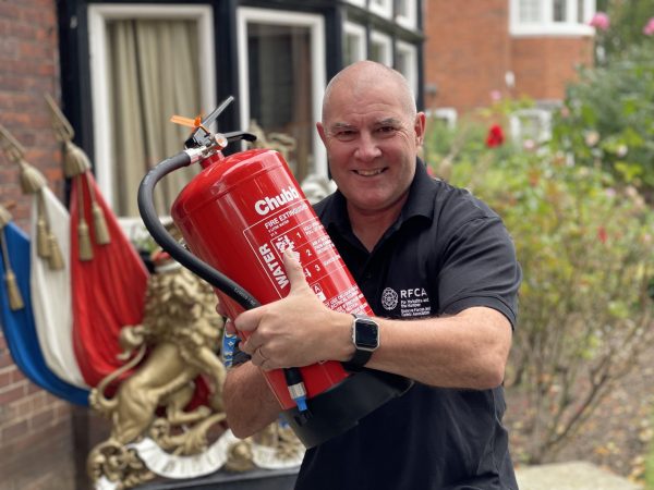 Man holding fire extinguisher